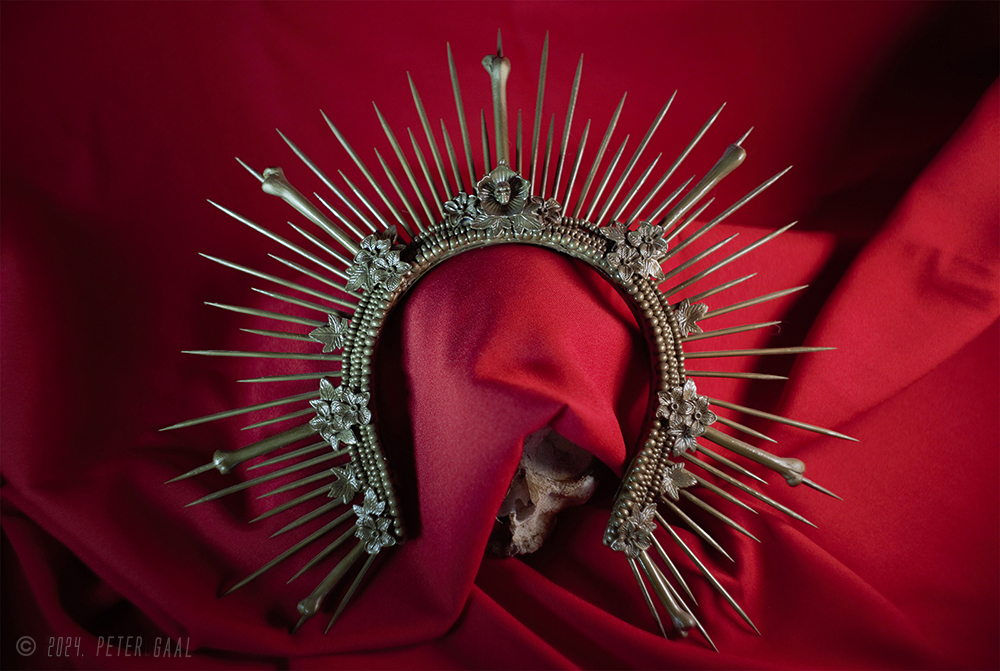 Diadem of Self-importance a sculptural creation, inlaid with pearls, gilded bones and spikes imitating rays of light.